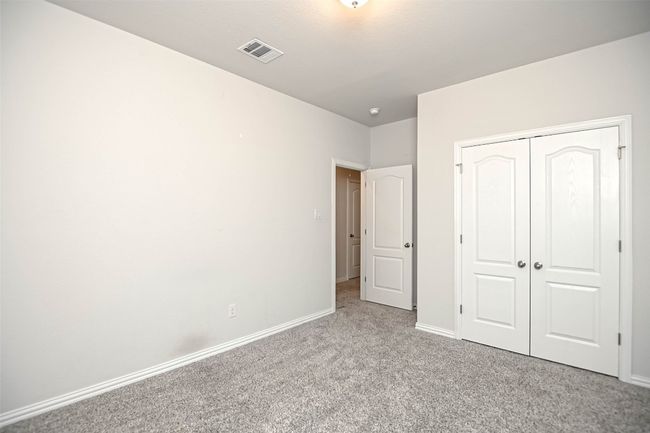 Unfurnished bedroom featuring baseboards, visible vents, a closet, and carpet floors | Image 29