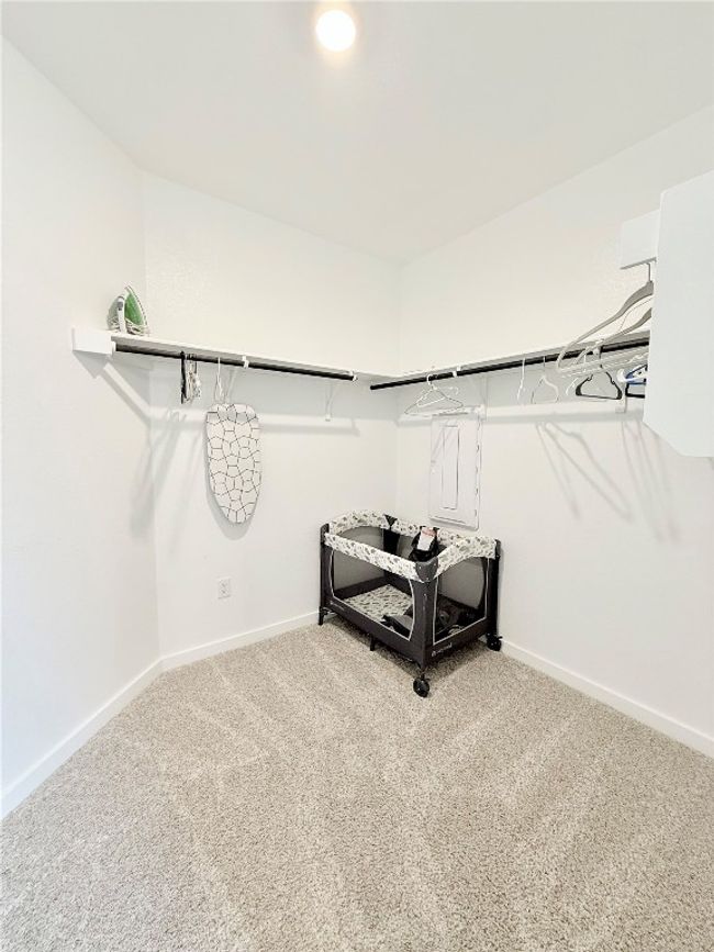 Walk in closet featuring carpet floors | Image 26