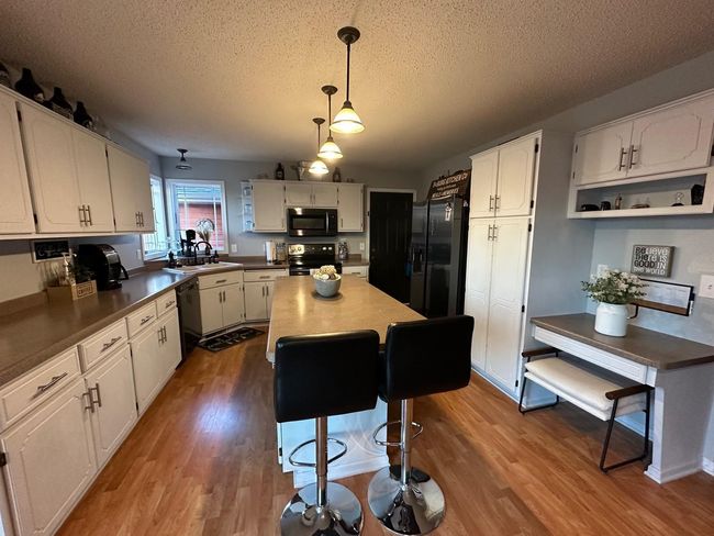 Kitchen also includes a computer/work area | Image 7