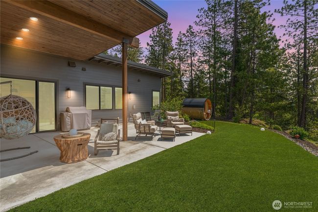Enjoy meticulously landscaped grounds that enhance the natural beauty of the property, offering peaceful outdoor spaces to relax and unwind | Image 35