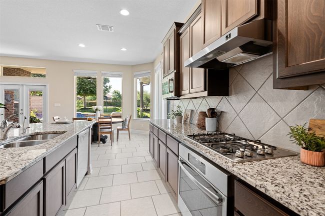 Chef's kitchen with built in stainless steel appliances | Image 10