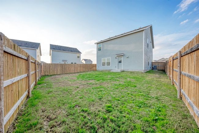 Back of property featuring cooling unit | Image 33