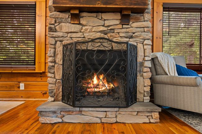 You'll enjoy a beautiful stone wood-burning fireplace. | Image 10