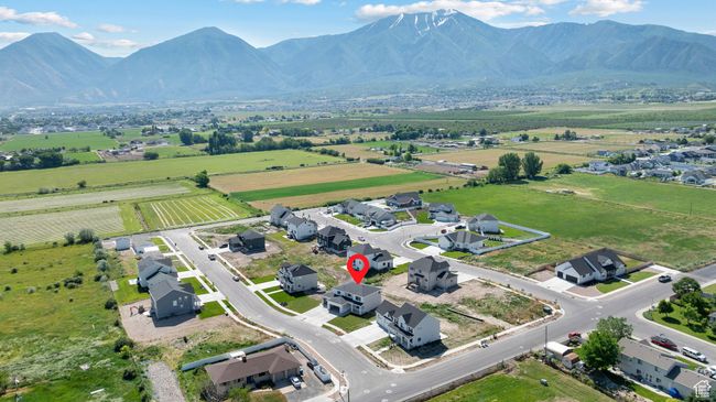 Aerial view of sparsely populated area with a mountainous background | Image 38