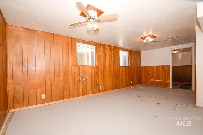 Spare room with wooden walls and concrete floors | Image 32