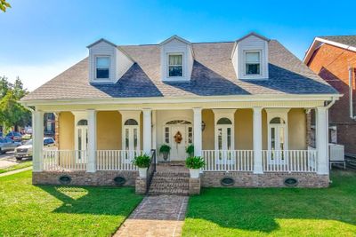 Great curb appeal! Relax on your front brick porch and feel the lake breeze! | Image 1