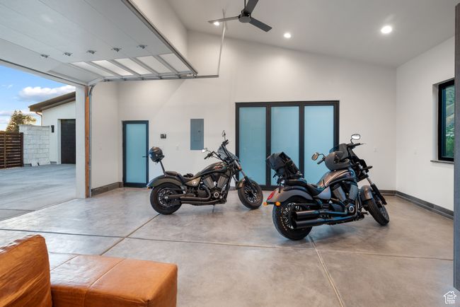 Garage featuring electric panel, recessed lighting, and ceiling fan | Image 72