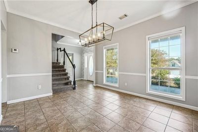 Tiled foyer featuring ornamental molding | Image 2