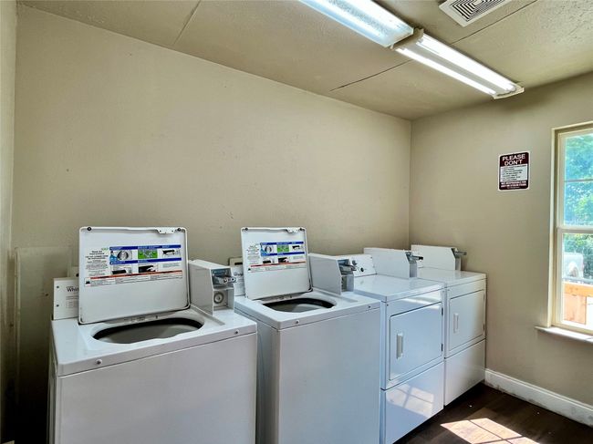 Here is a picture of the shared laundry room. | Image 17
