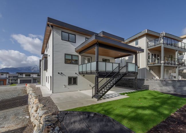 Back of property with a yard, stairway, and a patio | Image 33