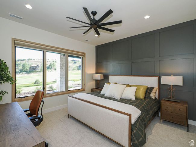 Bedroom featuring a decorative wall, recessed lighting, light colored carpet, and ceiling fan | Image 81