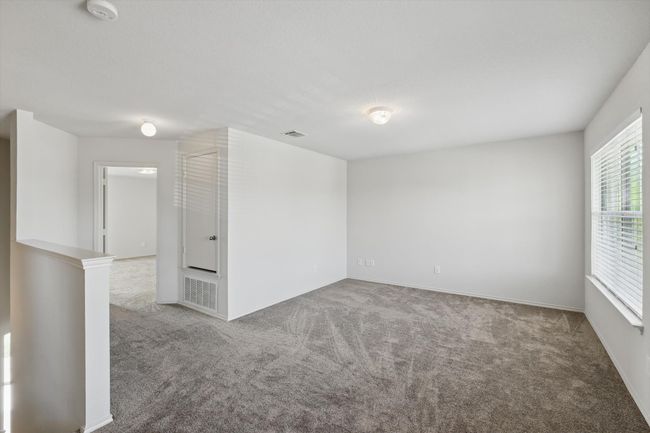 Carpeted spare room with a smoke detector and baseboards | Image 18