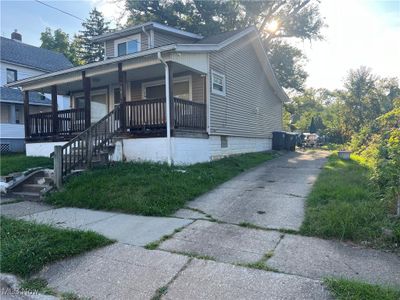 View of home's exterior with a porch | Image 2