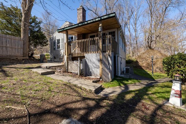 Back of property featuring a chimney and central AC unit | Image 10