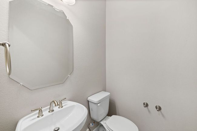 Half bath with toilet and a sink | Image 7
