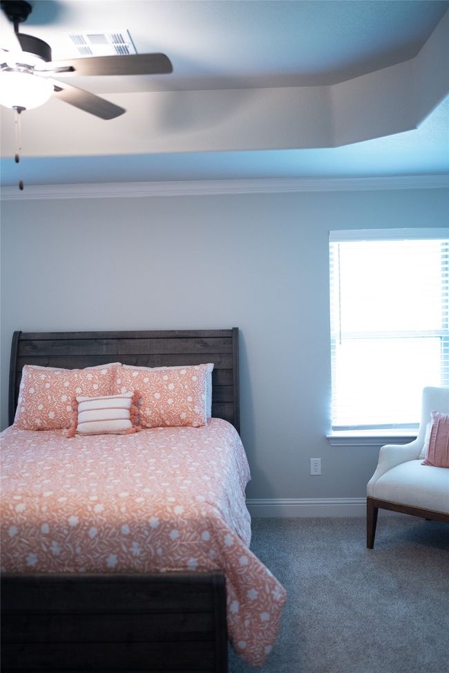 Bedroom featuring baseboards, visible vents, ceiling fan, and carpet | Image 14