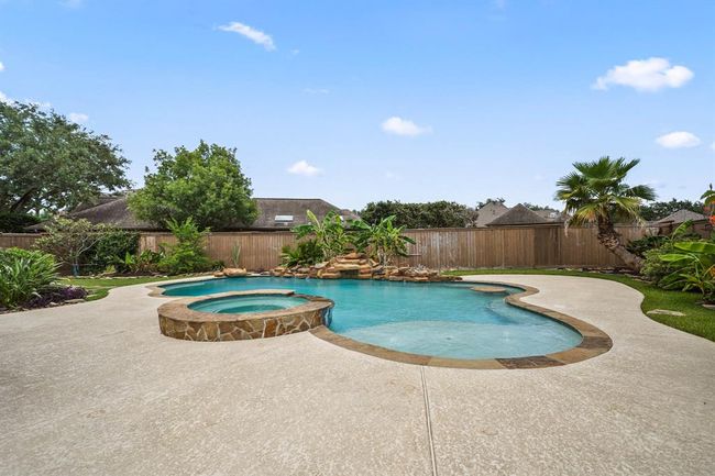 the pool deck features multiple umbrella stand holes for easy shade | Image 29