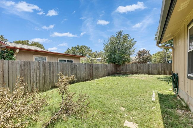 View of fenced backyard | Image 16
