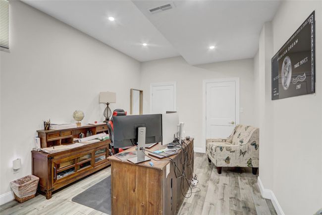 Office featuring light wood finished floors, baseboards, and recessed lighting | Image 29