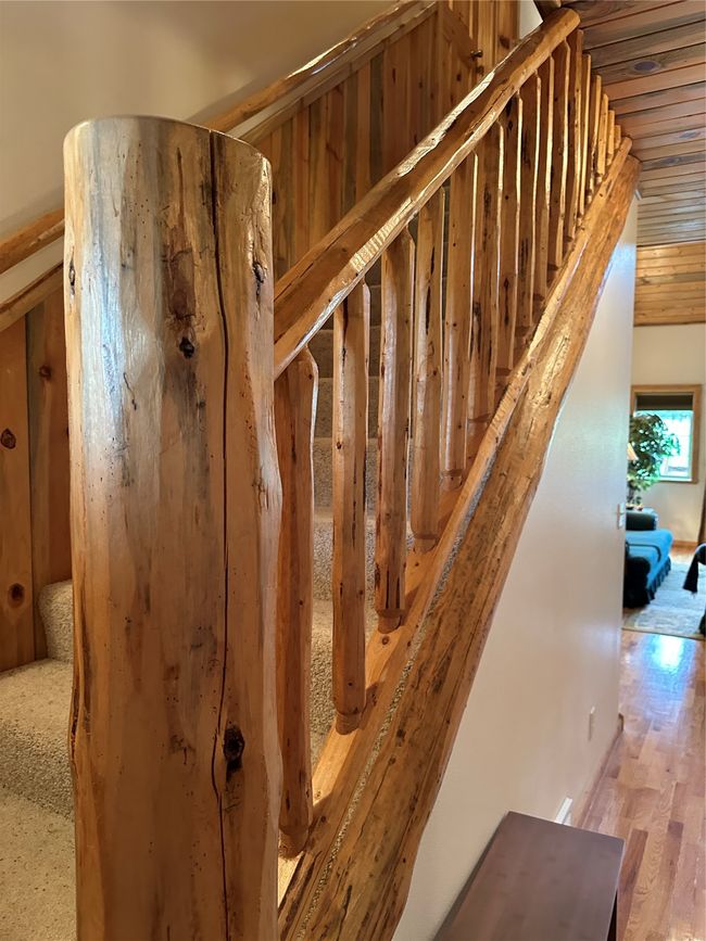 Custom hand hewn log accent Stairway, tongue & Groove Wainscotting. | Image 36
