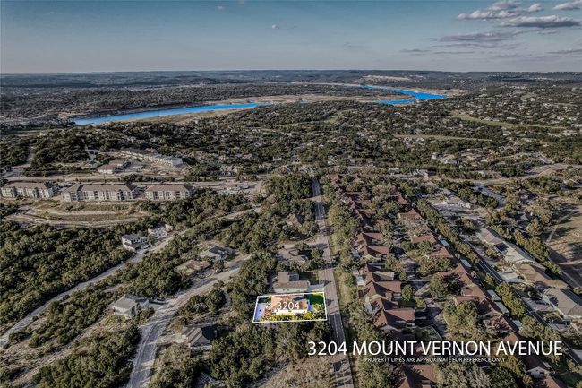 Aerial view of residential area with a large body of water | Image 35