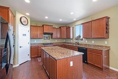 Custom kitchen with slab granite counters. | Image 2