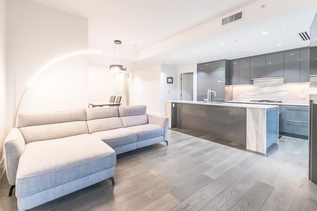 Living room featuring light wood-type flooring, visible vents, and recessed lighting | Image 5