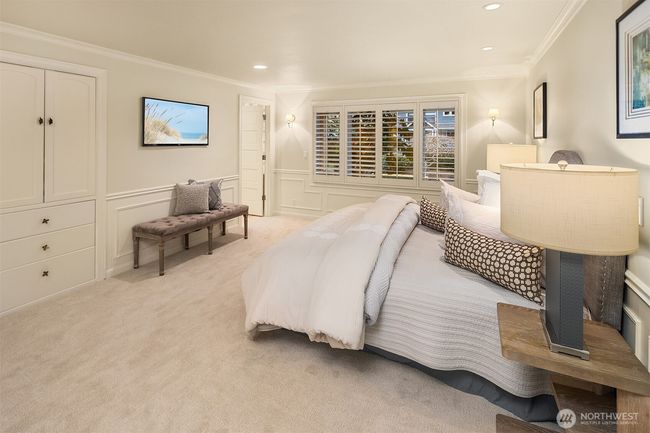 Exuding a serene ambiance, the primary suite envelops one in an aura of tranquility the minutes you walk in the room. Not shown are huge his and her separate walk in closets ... everybodies dream situation!! | Image 16