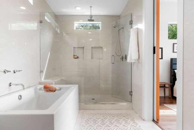Soak in your oversized tub looking out over the hill country. Oversized shower with dual heads & bench. | Image 20