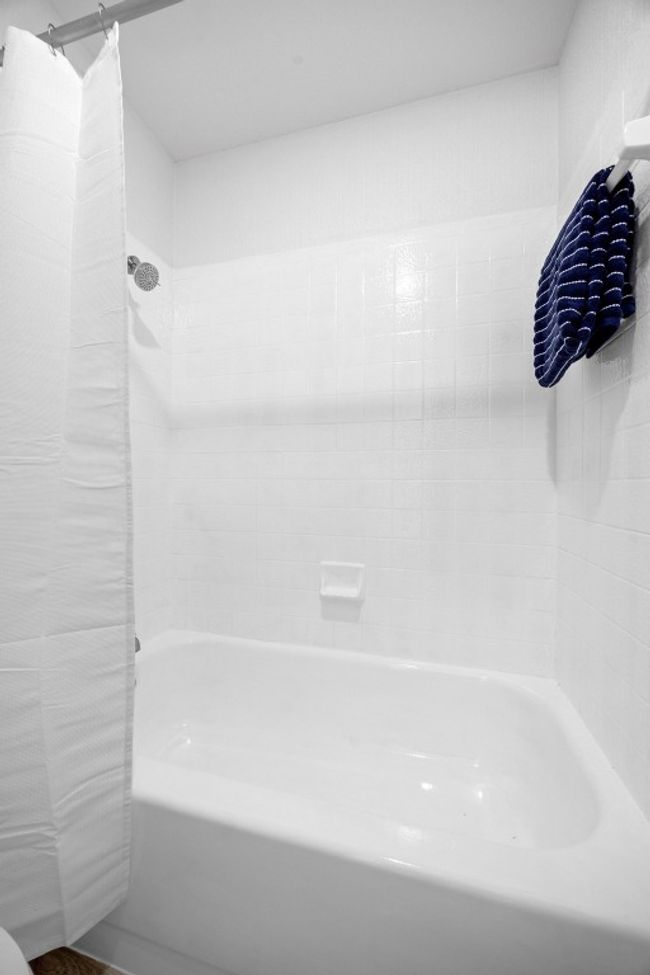 Primary bathroom with shower / tub combo with curtain | Image 16