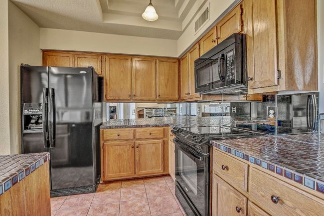 Kitchen feels larger than a typical galley style kitchen. Good amount of counter space | Image 14