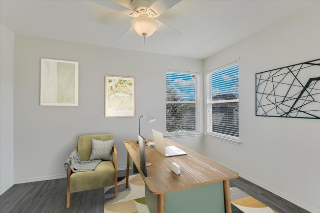 Virtually Staged Office space with dark wood finished floors and ceiling fan | Image 5