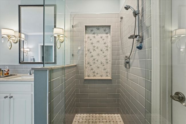 Bathroom featuring vanity and a tile shower | Image 26