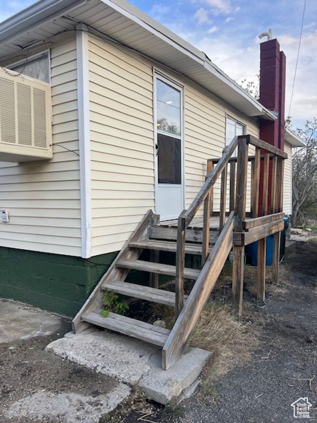 Back northern side entrance to property with a chimney | Image 21