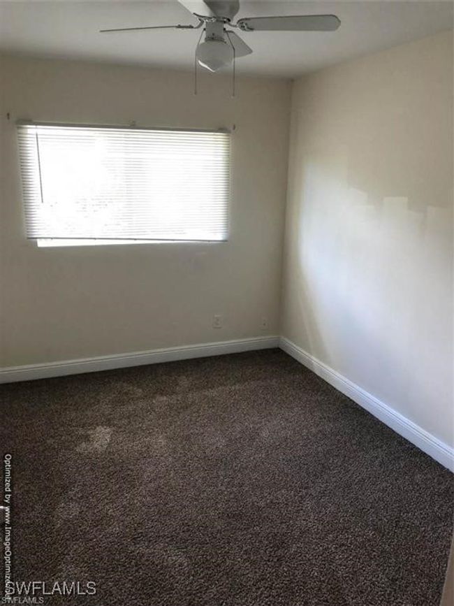 Unfurnished room featuring carpet flooring and ceiling fan | Image 8