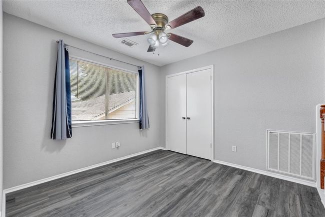 Upstairs game are or work space overlooking the living room. | Image 21