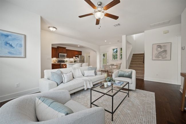 The seamless flow into the kitchen and dining area makes this living room ideal for gatherings, allowing conversation to effortlessly move from space to space | Image 11