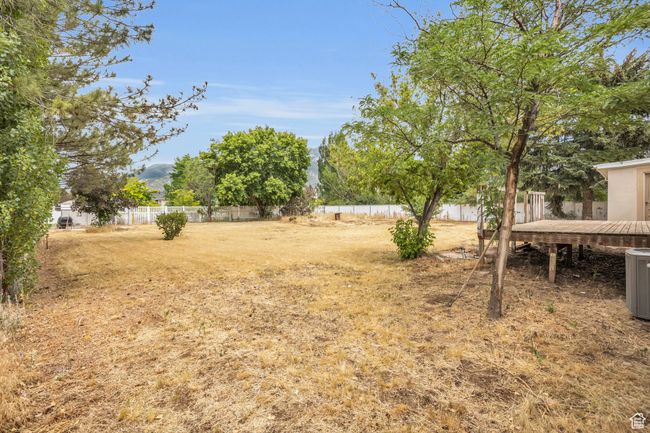 View of yard featuring a fenced backyard and a wooden deck | Image 30