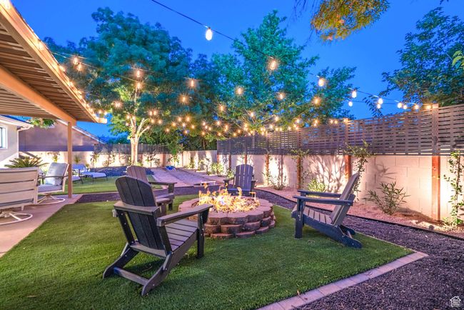 View of yard featuring a fire pit | Image 17