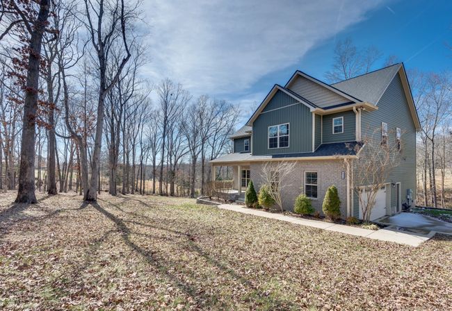 Larger concrete drive and walkway. Beautiful Setting | Image 6