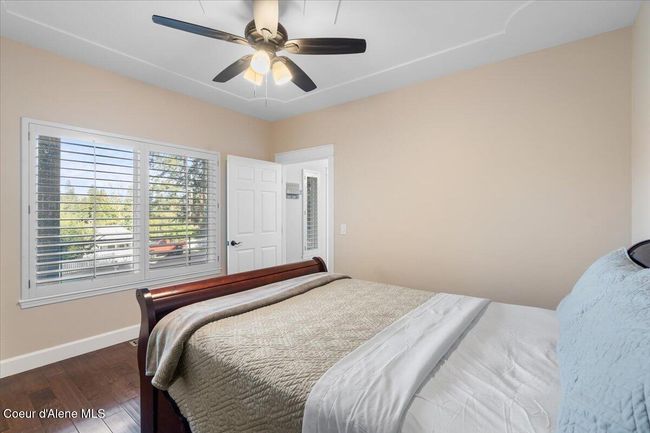 Main level primary bedroom with views of the lake! | Image 22