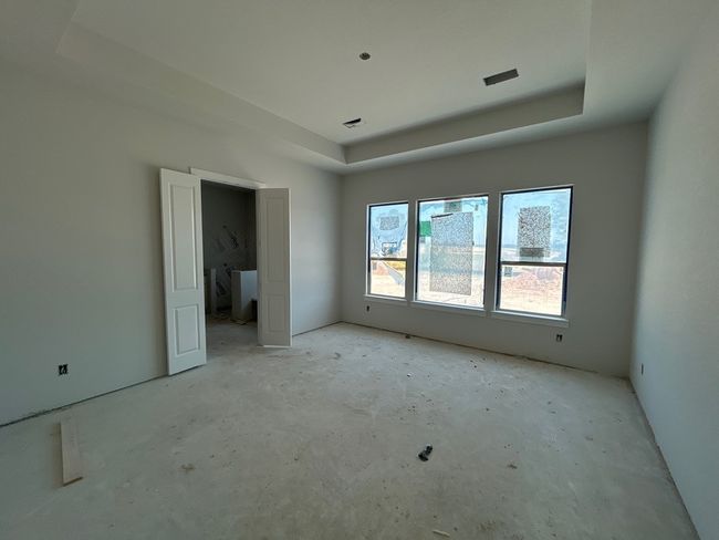 Spare room with a raised ceiling | Image 7