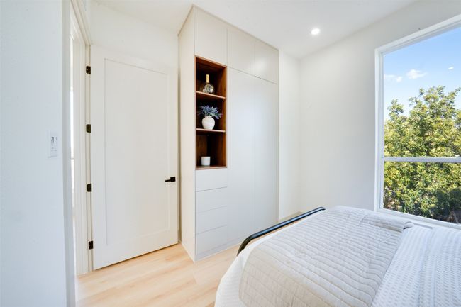 Bedroom featuring light hardwood / wood-style flooring | Image 26