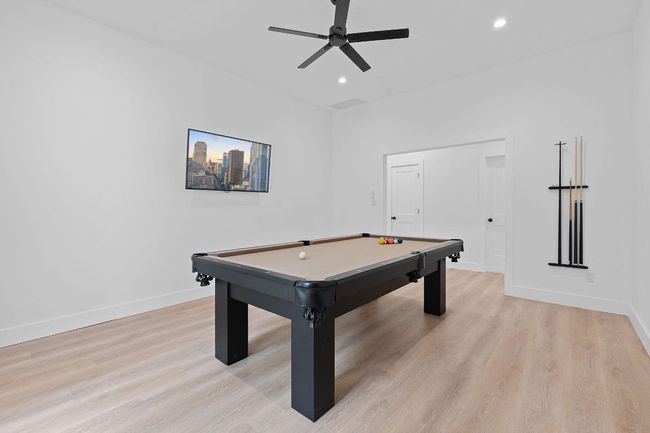 Game room with billiards, fan, baseboards, french doors, and light wood type floors | Image 18
