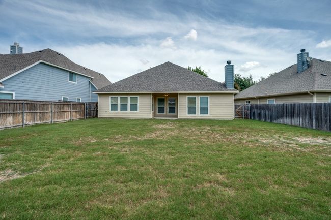 Rear view of house with a chimney | Image 16