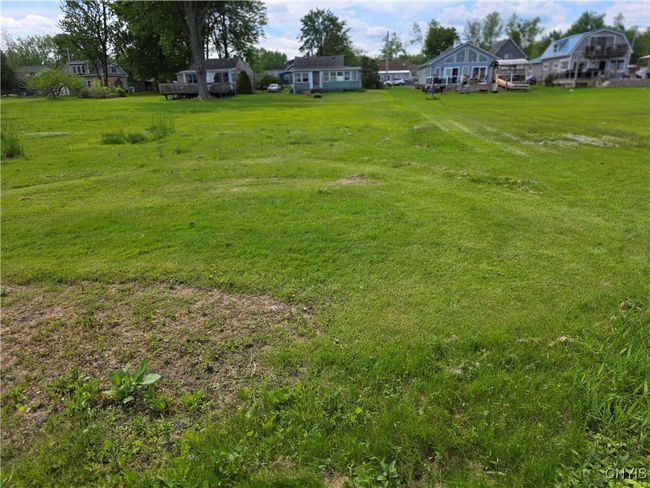 View from lakefront back to where your custom home will be built | Image 11
