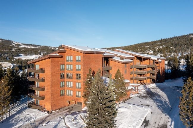 Snow covered property with a mountain view | Image 28