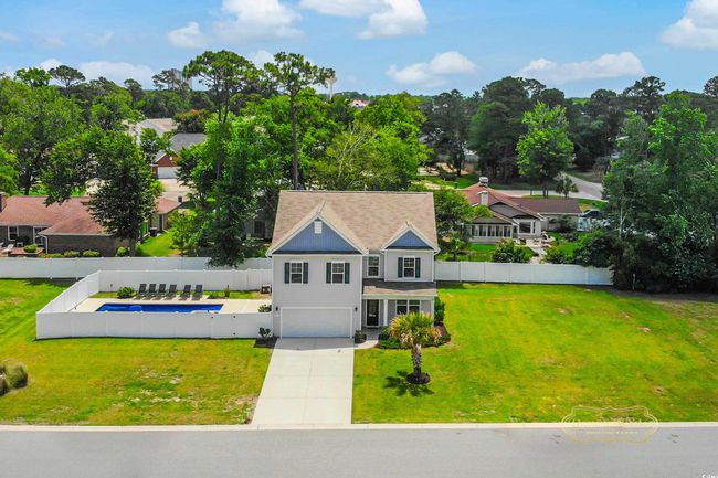View from above of property with a tree filled landscape | Image 34