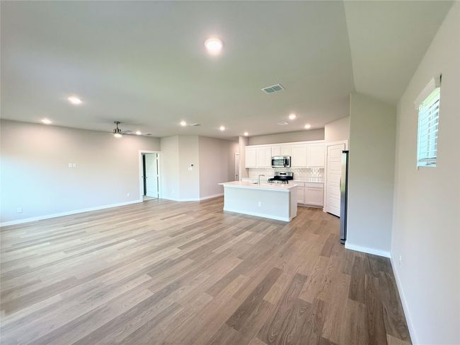 Unfurnished living room with recessed lighting and light wood finished floors | Image 9