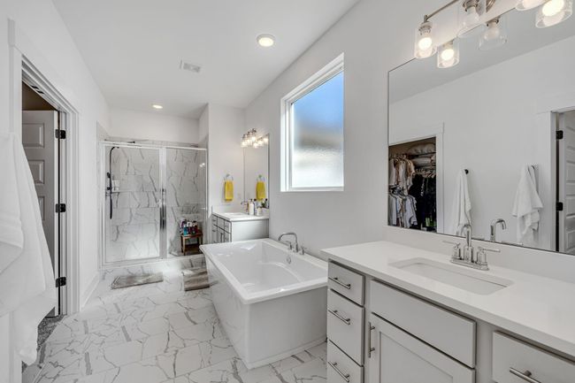 Owner's bath with great tile work and a large walk-in closet attached. | Image 10
